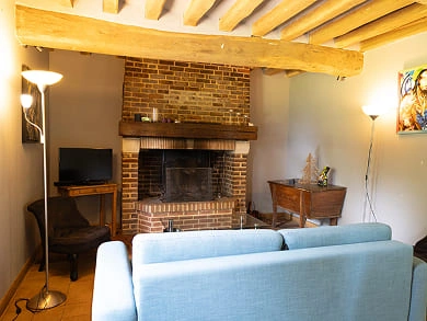 Coin salon de l'ancienne écurie, gite typique normand